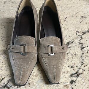 These shoes were made in Italy and are 2 1/2 heels.